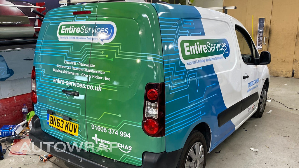 Graphics, lettering and a partial wrap on a van for Entire Services