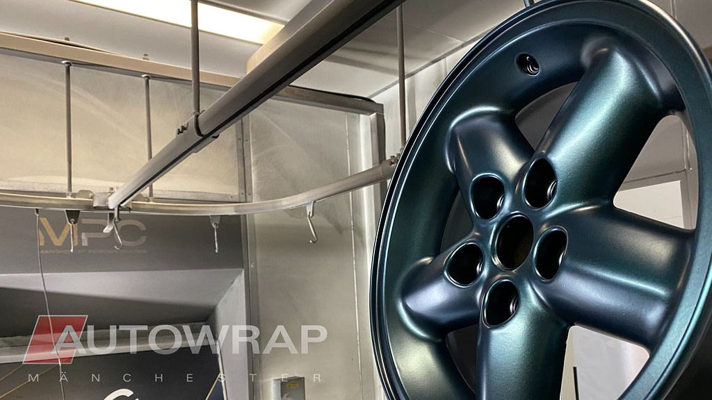 A wheel powder coated in a satin green